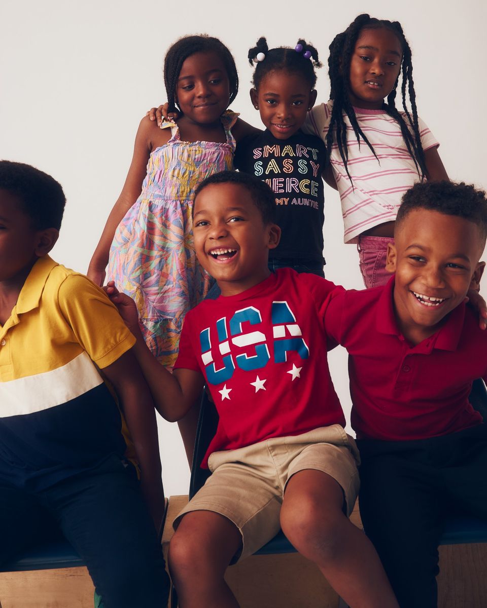 A group of smiling young students posing together